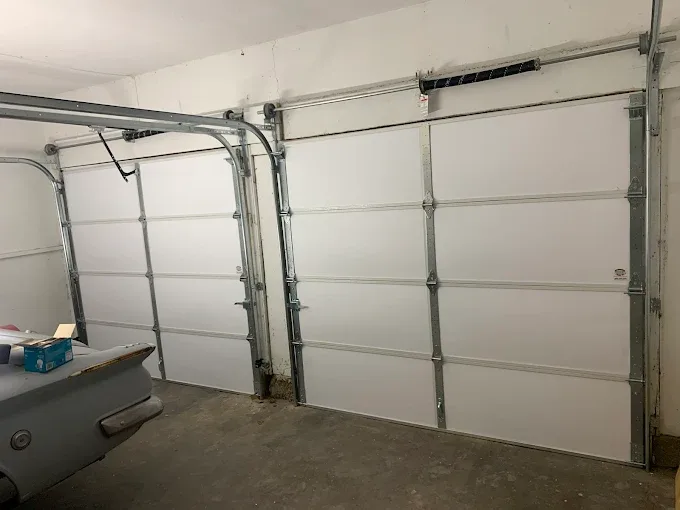 Garage door tracks and hardware installation interior view by Affordable Door Co Oklahoma City